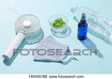Stock Photo - Face Mask And Handy Fan. Fotosearch