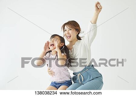 Picture - Family Watching A Game And Cheering. Fotosearch
