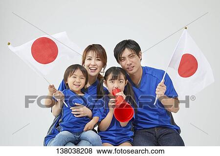 Stock Photo - Family Watching A Game And Cheering. Fotosearch
