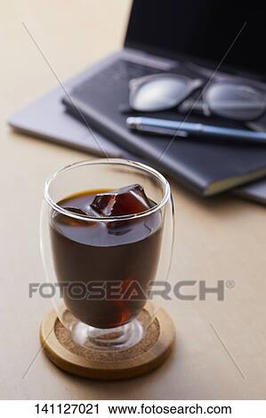 Glass Of Coffee On The Desk View Large Photo Image Stock Image - Glass Of Coffee On The Desk. Fotosearch
