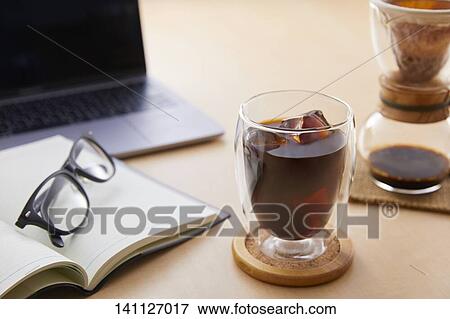 Glass Of Coffee On The Desk View Large Photo Image Stock Photo - Glass Of Coffee On The Desk. Fotosearch