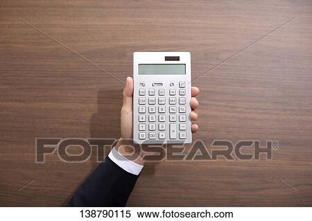 Hand Holding An Electronic Calculator View Large Photo Image Stock Photography - Hand Holding An Electronic Calculator. Fotosearch
