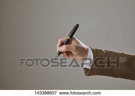 Hand holding pen View Large Photo Image Stock Photo - Hand holding pen. Fotosearch