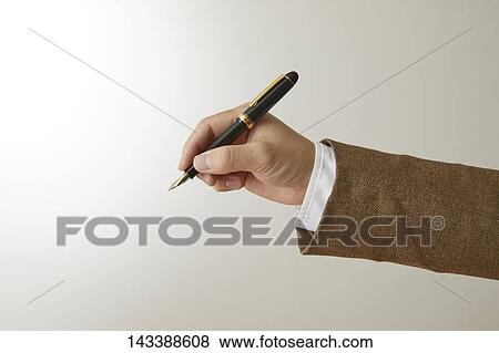 Stock Photo - Hand holding pen. Fotosearch