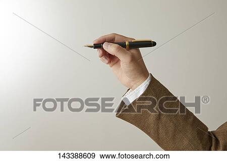 Hand holding pen View Large Photo Image Stock Photo - Hand holding pen. Fotosearch