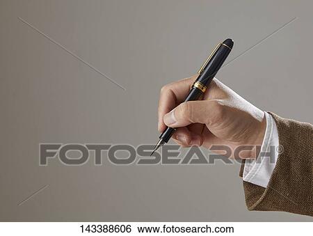Hand holding pen View Large Photo Image Stock Photograph - Hand holding pen. Fotosearch