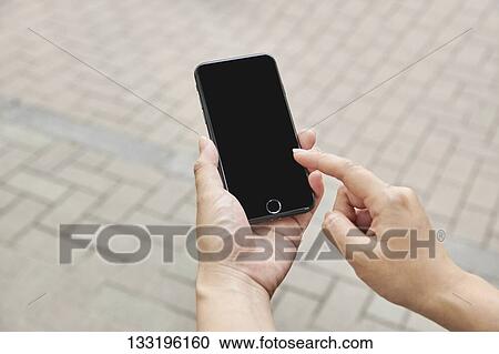 Hand Holding Smartphone View Large Photo Image Stock Image - Hand Holding Smartphone. Fotosearch