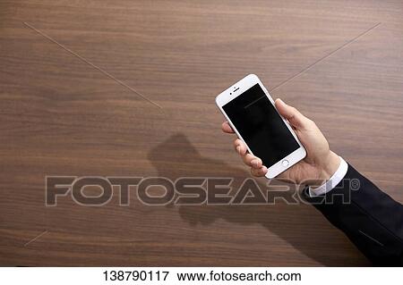 Hand Holding Smartphone View Large Photo Image Stock Photo - Hand Holding Smartphone. Fotosearch