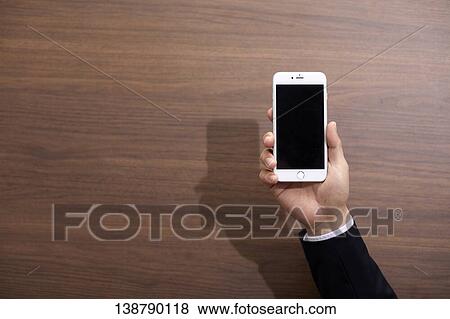 Hand Holding Smartphone View Large Photo Image Stock Photo - Hand Holding Smartphone. Fotosearch