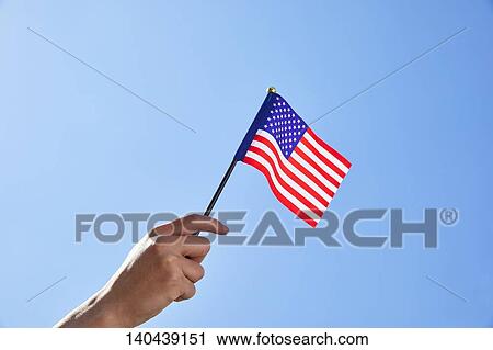 Stock Image - Hand With American Flag. Fotosearch