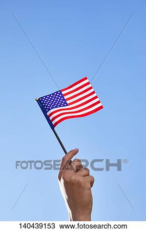 Stock Image - Hand With American Flag. Fotosearch