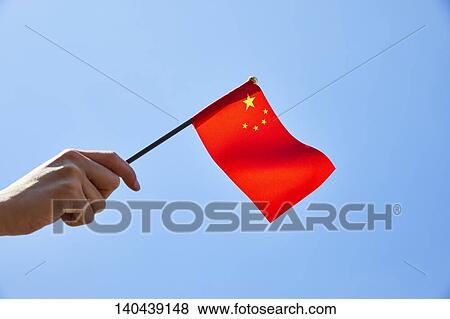Stock Photo - Hand With Chinese Flag. Fotosearch