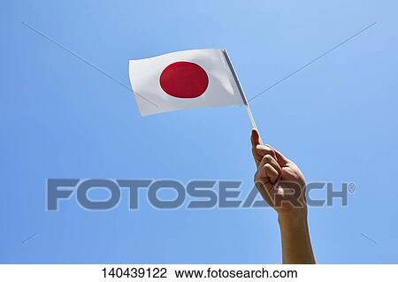 Stock Image - Hand With Japanese Flag. Fotosearch