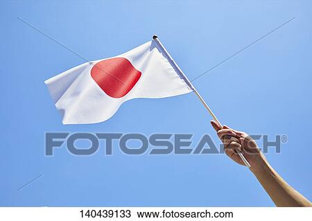 Stock Image - Hand With Japanese Flag. Fotosearch