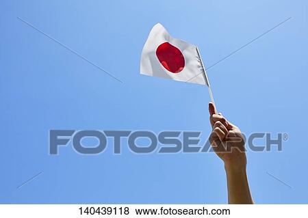 Stock Photo - Hand With Japanese Flag. Fotosearch