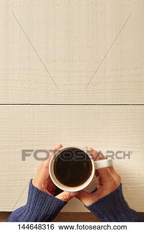 Hands holding cup of coffee View Large Photo Image Stock Photograph - Hands holding cup of coffee. Fotosearch