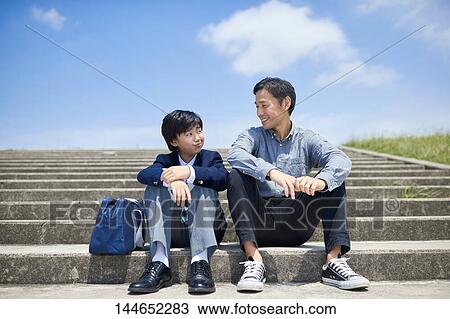 Happy Japanese father and son outdoors View Large Photo Image Stock Image - Happy Japanese father and son outdoors. Fotosearch