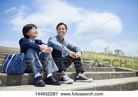Happy Japanese father and son outdoors View Large Photo Image Stock Photo - Happy Japanese father and son outdoors. Fotosearch