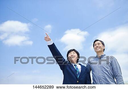 Happy Japanese father and son outdoors View Large Photo Image Stock Photo - Happy Japanese father and son outdoors. Fotosearch