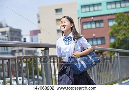 Stock Image - Happy Japanese junior high schoolgirl. Fotosearch