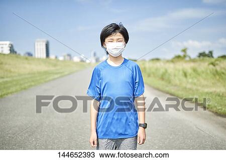 Happy Japanese teenager enjoying himself outdoors View Large Photo Image Stock Image - Happy Japanese teenager enjoying himself outdoors. Fotosearch