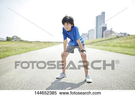 Happy Japanese teenager enjoying himself outdoors View Large Photo Image Stock Photography - Happy Japanese teenager enjoying himself outdoors. Fotosearch