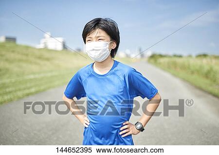 Happy Japanese teenager enjoying himself outdoors View Large Photo Image Stock Photography - Happy Japanese teenager enjoying himself outdoors. Fotosearch