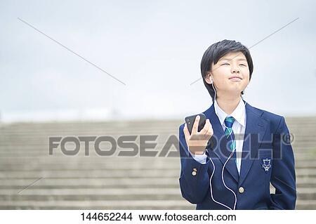 Happy Japanese teenager outdoors View Large Photo Image Picture - Happy Japanese teenager outdoors. Fotosearch