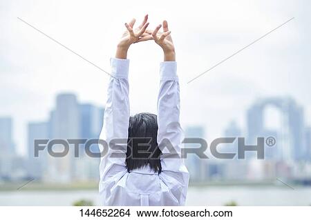 Picture - Happy Japanese teenager outdoors. Fotosearch