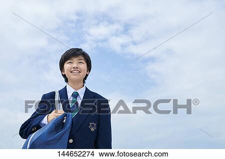 Picture - Happy Japanese teenager outdoors. Fotosearch
