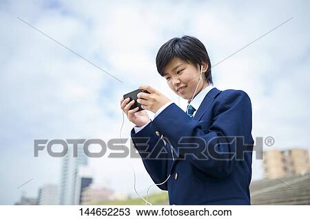 Happy Japanese teenager outdoors View Large Photo Image Stock Image - Happy Japanese teenager outdoors. Fotosearch