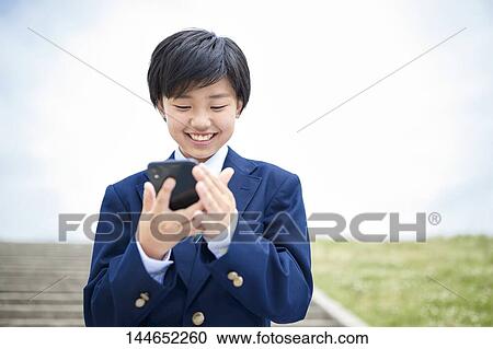 Happy Japanese teenager outdoors View Large Photo Image Stock Image - Happy Japanese teenager outdoors. Fotosearch