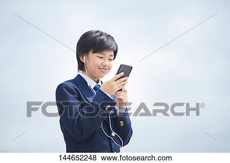 Happy Japanese teenager outdoors View Large Photo Image Stock Photo - Happy Japanese teenager outdoors. Fotosearch