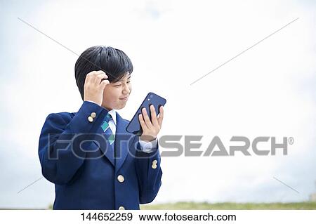 Happy Japanese teenager outdoors View Large Photo Image Stock Photo - Happy Japanese teenager outdoors. Fotosearch