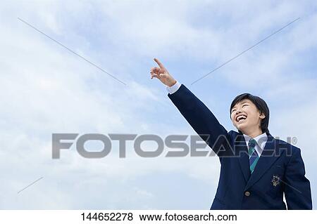 Stock Photo - Happy Japanese teenager outdoors. Fotosearch