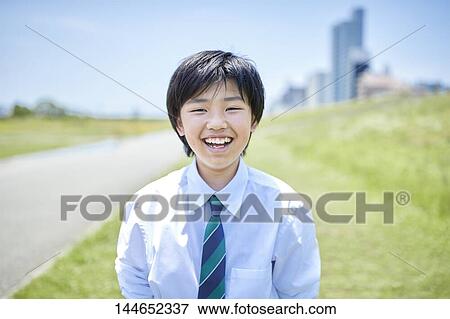 Happy Japanese teenager outdoors View Large Photo Image Stock Photo - Happy Japanese teenager outdoors. Fotosearch