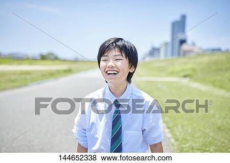 Happy Japanese teenager outdoors View Large Photo Image Stock Photo - Happy Japanese teenager outdoors. Fotosearch
