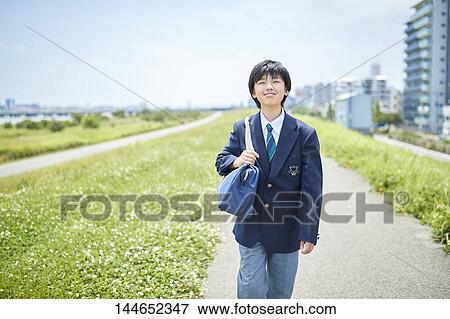 Happy Japanese teenager outdoors View Large Photo Image Stock Photo - Happy Japanese teenager outdoors. Fotosearch