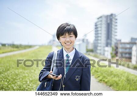 Happy Japanese teenager outdoors View Large Photo Image Stock Photo - Happy Japanese teenager outdoors. Fotosearch