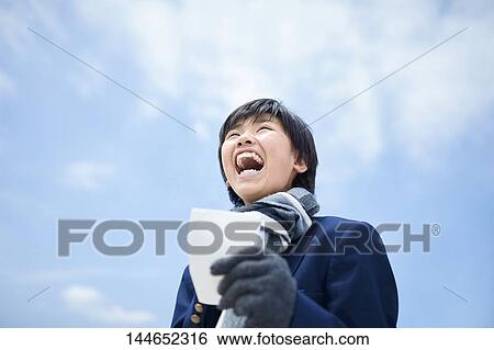Happy Japanese teenager outdoors View Large Photo Image Stock Photograph - Happy Japanese teenager outdoors. Fotosearch