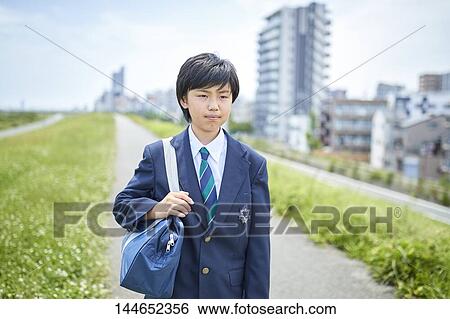 Happy Japanese teenager outdoors View Large Photo Image Stock Photograph - Happy Japanese teenager outdoors. Fotosearch