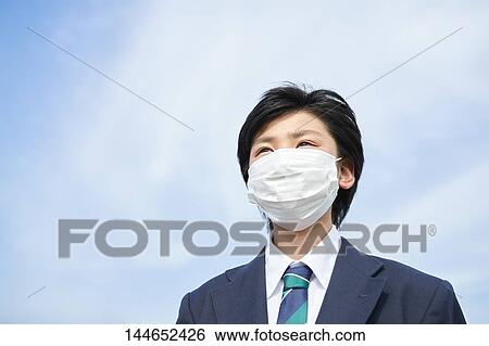 Stock Photograph - Happy Japanese teenager outdoors. Fotosearch