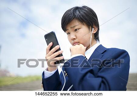 Happy Japanese teenager outdoors View Large Photo Image Stock Photography - Happy Japanese teenager outdoors. Fotosearch
