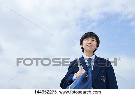 Stock Photography - Happy Japanese teenager outdoors. Fotosearch