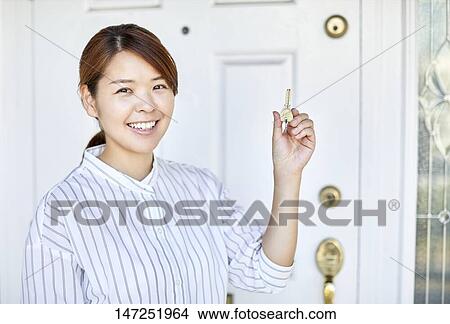 Happy Japanese woman at home View Large Photo Image Picture - Happy Japanese woman at home. Fotosearch