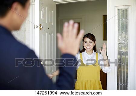 Picture - Happy Japanese woman at home. Fotosearch