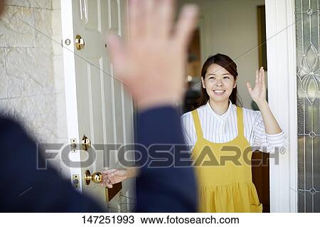 Stock Image - Happy Japanese woman at home. Fotosearch