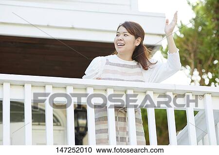 Happy Japanese woman at home View Large Photo Image Stock Image - Happy Japanese woman at home. Fotosearch