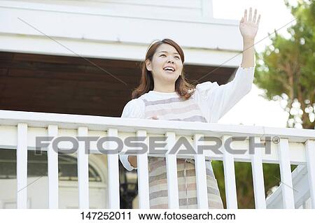 Happy Japanese woman at home View Large Photo Image Stock Image - Happy Japanese woman at home. Fotosearch