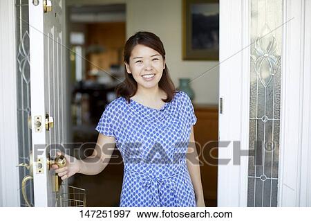Happy Japanese woman at home View Large Photo Image Stock Photo - Happy Japanese woman at home. Fotosearch